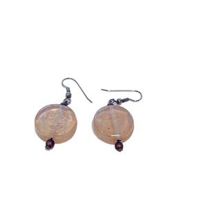 Peach colored glass earrings.